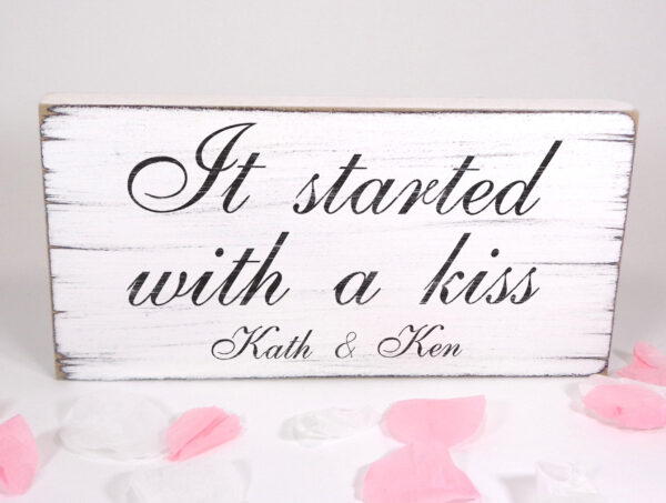 personalised it started with a kiss wedding sign