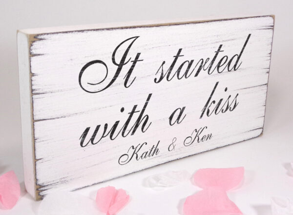 personalised it started with a kiss wedding sign